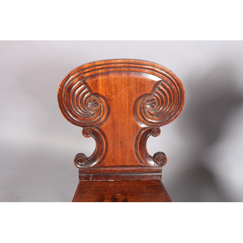 101 - A Victorian mahogany hall chair with panelled cartouche shaped back, the serpentine bordered seat ab... 