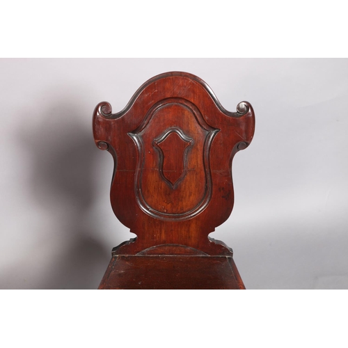 101 - A Victorian mahogany hall chair with panelled cartouche shaped back, the serpentine bordered seat ab... 