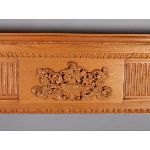 113 - A George III style hardwood fireplace with plain mantle with bead carved border the frieze centered ... 