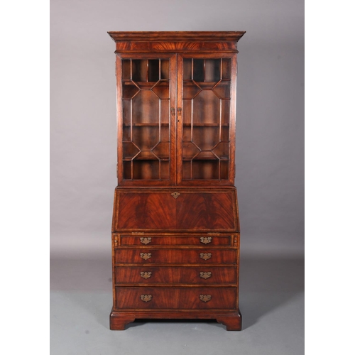 117 - A George III mahogany designed bureau-bookcase crossbanded and boxwood strung, having two astragal g... 