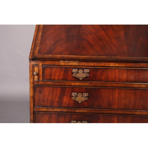 117 - A George III mahogany designed bureau-bookcase crossbanded and boxwood strung, having two astragal g... 