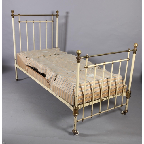 119 - A Victorian brass and cast iron single bedstead  retailed by Heals, metal decal to end rail, of rail... 