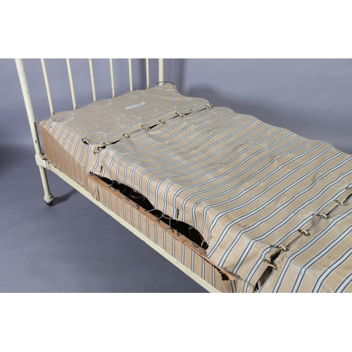 119 - A Victorian brass and cast iron single bedstead  retailed by Heals, metal decal to end rail, of rail... 