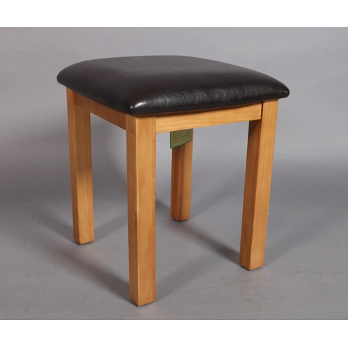 127 - A square footstool with brown simulated leather stuffed over top, 40cm square