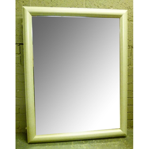 105 - A white framed rectangular wall mirror, bevelled glass, 117cm x 89cm