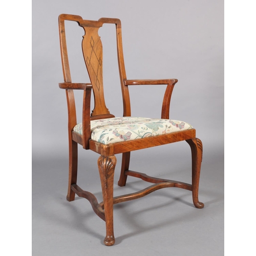 107 - An Edwardian figured mahogany elbow chair, the vase shaped splat inlaid with parquetry stringing, dr... 