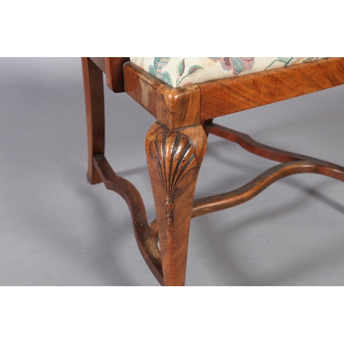 107 - An Edwardian figured mahogany elbow chair, the vase shaped splat inlaid with parquetry stringing, dr... 