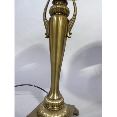 108 - A Regency style metal column table lamp with acanthus wrapped base and three lion paw feet on the in... 