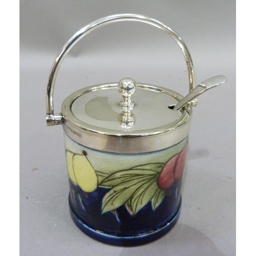 11 - A Moorcroft and silver plate mounted preserve pot, of wisteria pattern, tubelined and glazed in yell... 