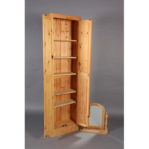 112 - A pine wardrobe enclosed by a pair of fielded panel doors, 204cm high x 56cm wide x 28cm deep togeth... 