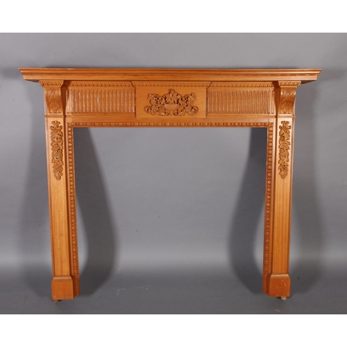 113 - A George III style hardwood fireplace with plain mantle with bead carved border the frieze centered ... 