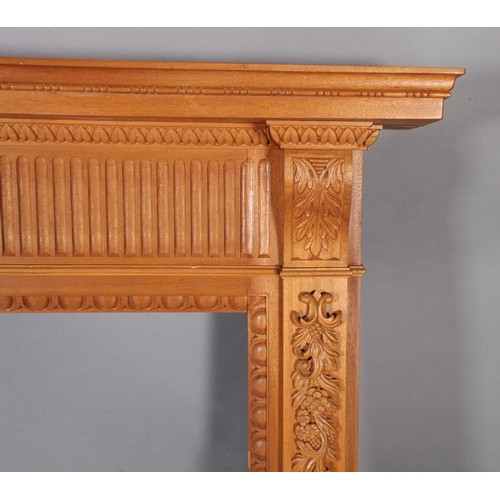 113 - A George III style hardwood fireplace with plain mantle with bead carved border the frieze centered ... 