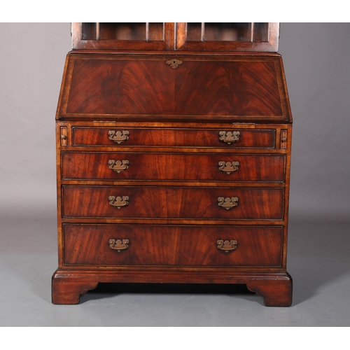 117 - A George III mahogany designed bureau-bookcase crossbanded and boxwood strung, having two astragal g... 