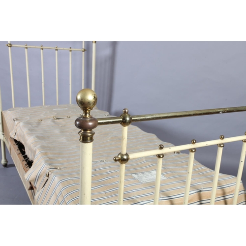 119 - A Victorian brass and cast iron single bedstead  retailed by Heals, metal decal to end rail, of rail... 