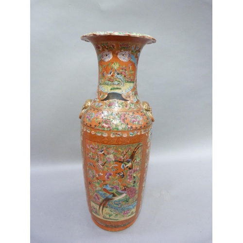 12 - A large Chinese famille rose vase, painted and enamelled with panels of exotic birds amongst peony w... 