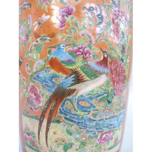 12 - A large Chinese famille rose vase, painted and enamelled with panels of exotic birds amongst peony w... 