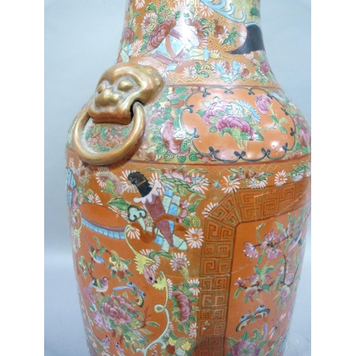 12 - A large Chinese famille rose vase, painted and enamelled with panels of exotic birds amongst peony w... 