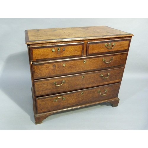 121 - A George III oak chest of drawers crossbanded throughout with mahogany, fitted with two short and th... 