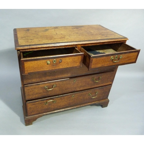 121 - A George III oak chest of drawers crossbanded throughout with mahogany, fitted with two short and th... 