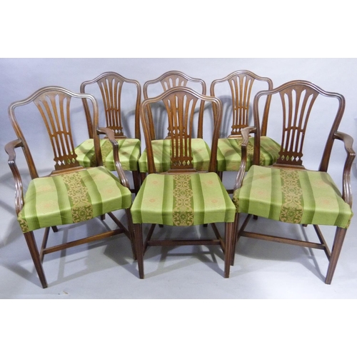 125 - A set of six mahogany dining chairs in Hepplewhite style, with camel shaped backs, pierced waisted s... 