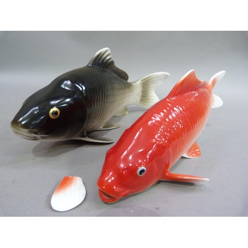 22 - A Noritake bone china figure of a carp 13.5cm long; together with another similar, the latter with o... 