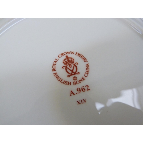 29 - A Royal Crown Derby 1128 pattern circular plate, 26.5cm diameter, together with two Royal Crown Derb... 