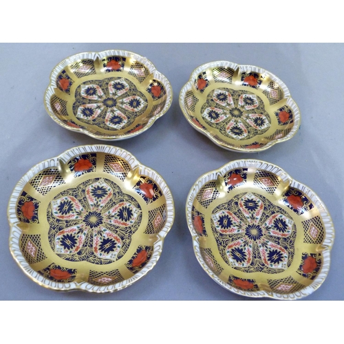 30 - A set of four Royal Crown Derby pattern 1128 shaped circular pin trays, 11.5cm wide