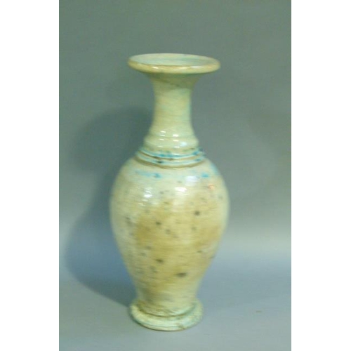 39 - A baluster vase with everted rim, the raku glaze tinted from duck egg blue to turquoise. on circular... 