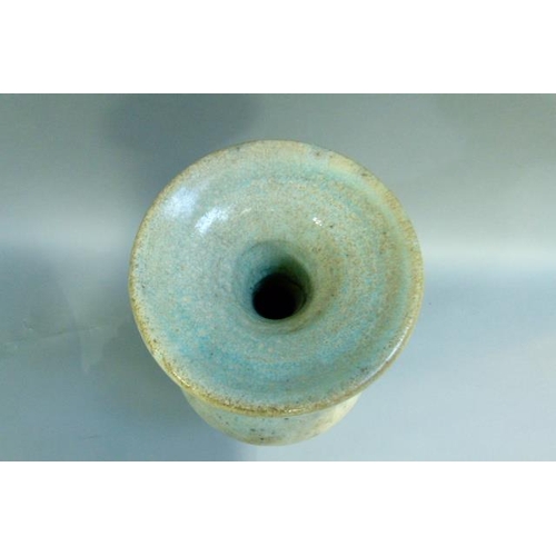 39 - A baluster vase with everted rim, the raku glaze tinted from duck egg blue to turquoise. on circular... 