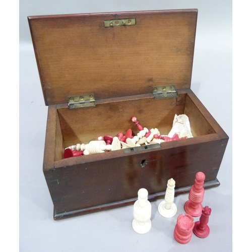 45 - A natural and red stained composite bone chess set and other part sets, contained in a mahogany stai... 