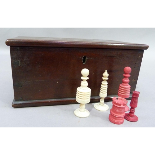 45 - A natural and red stained composite bone chess set and other part sets, contained in a mahogany stai... 