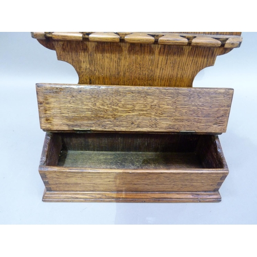 46 - An oak spoon rack with candle box, 55cm H x 31cm W