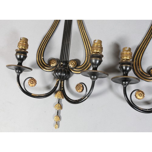 209 - A pair of black Japanned and brass two branch grandioles with lyre shaped back plates with vertical ... 