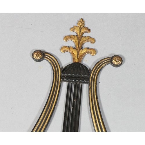 209 - A pair of black Japanned and brass two branch grandioles with lyre shaped back plates with vertical ... 