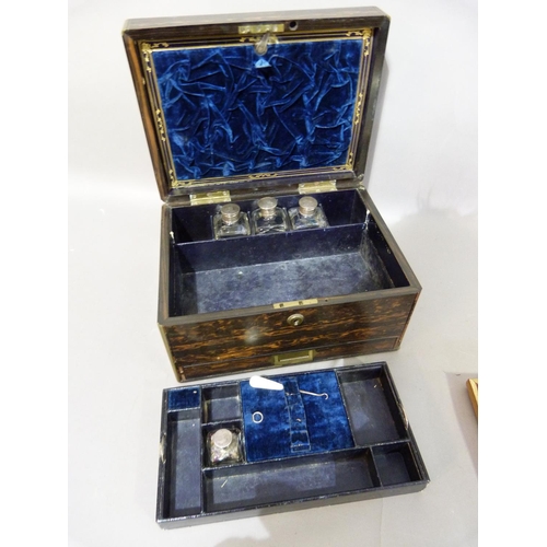 1 - A C19th coromandel dressing and jewel box, having a brass cartouche, interior inset with a mirror, l... 