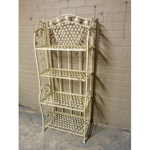 133 - A reproduction painted wrought iron folding four tier stand with serpentine shaped top, pierced with... 