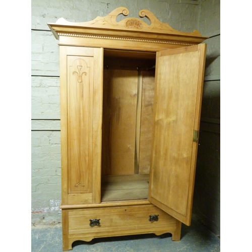 135 - A late Victorian satin-walnut wardrobe with broken cornice centred on a shell above flared dentil mo... 