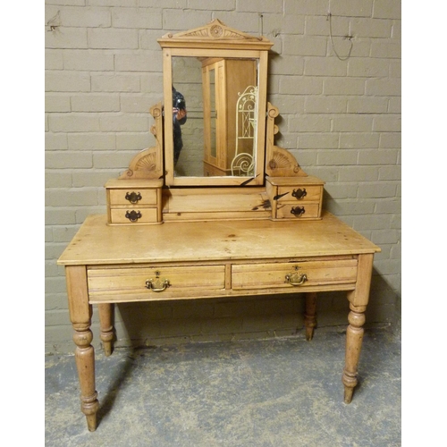 137 - A late Victorian dressing table, the mirror with carved architectural cornice supported on a pair of... 