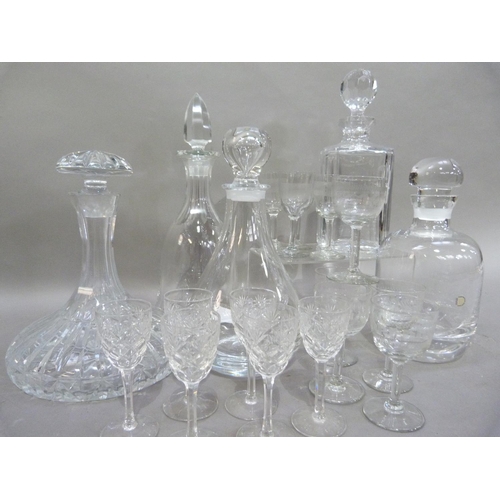 175 - A Dartington lead crystal decanter with mushroom stopper, 23cm; together with three other glass deca... 