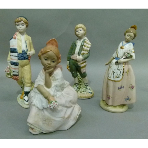 182 - Four various Nadal hand made Spanish figures, one sitting and three standing