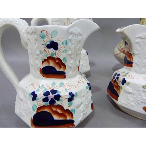 196 - An Edwardian pottery ewer printed and enamelled with flowers on an ivory ground between yellow and g... 