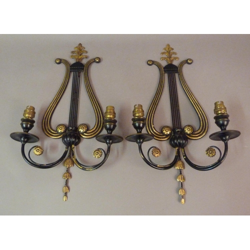 209 - A pair of black Japanned and brass two branch grandioles with lyre shaped back plates with vertical ... 