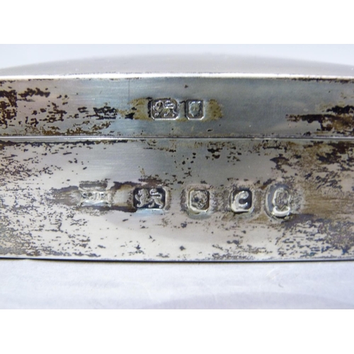 239 - A silver cigarette box with engine turned cover, London 1937, 14cm wide, together with another Londo... 