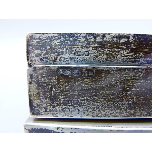 239 - A silver cigarette box with engine turned cover, London 1937, 14cm wide, together with another Londo... 