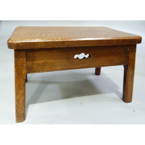 245 - An oak rectangular stool, the deep apron with quatrefoil cut outs and on square chamfered legs, 41cm... 