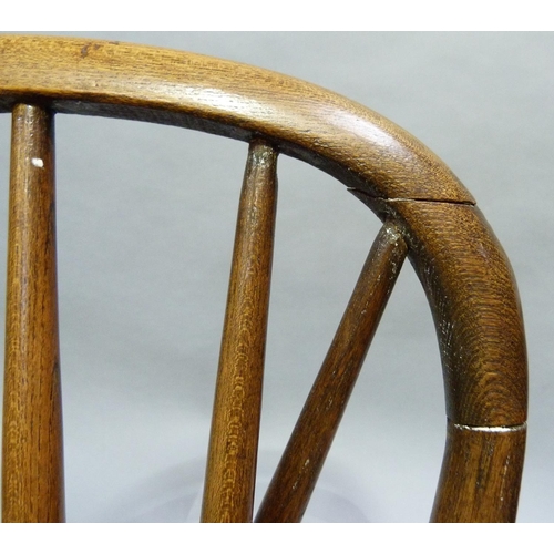 246 - A child's oak rail back chair, serpentine arms, on turned legs with 'H' stretcher, 63cm H at back