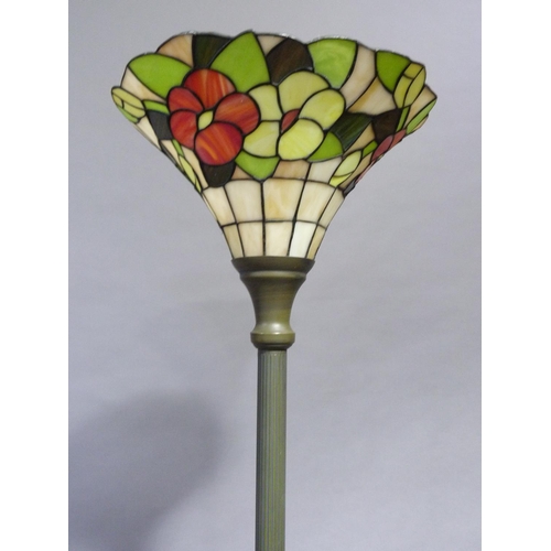 259 - A Tiffany style up lighter with trumpet shaped shade on a reeded column and circular base, 180cm