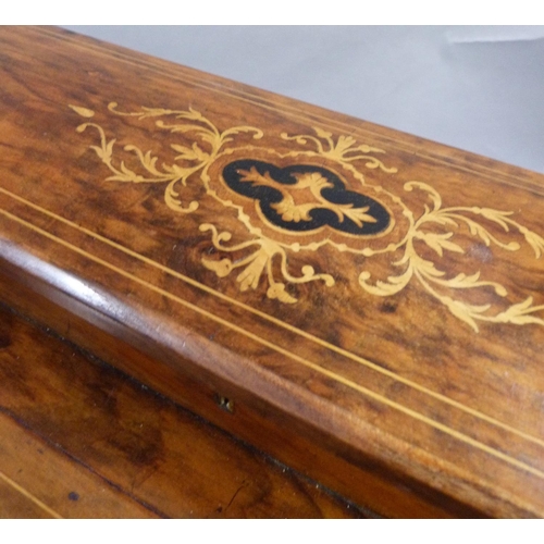 279 - A Victorian walnut Davenport inlaid in box and ebony with foliate scrolls having a raised stationery... 