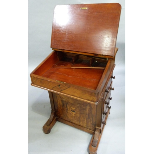 279 - A Victorian walnut Davenport inlaid in box and ebony with foliate scrolls having a raised stationery... 