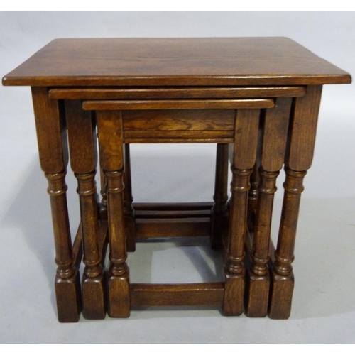 323 - A good nest of oak occasional tables, rectangular on turned and square framing, largest being 54cm L... 